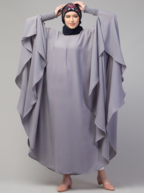 Nazneen smoking at sleeve Irani kaftan