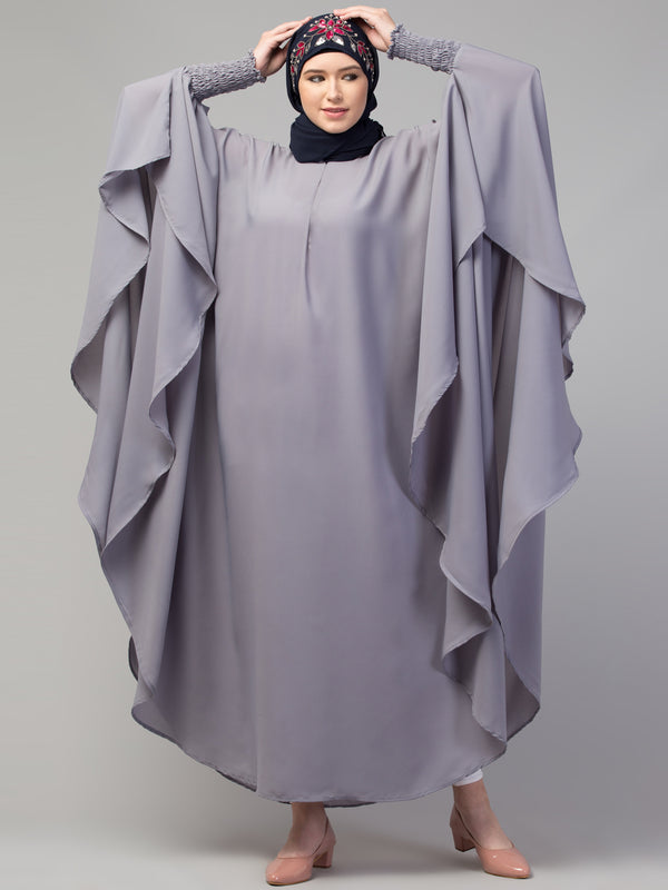 Nazneen smoking at sleeve Irani kaftan
