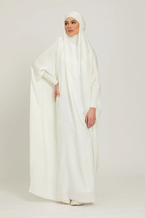White one piece jilbab in firdaus with smocky sleeves and attached mouthpiece